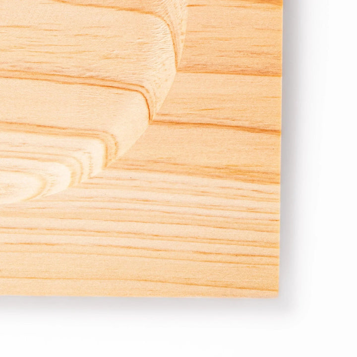 Square hinoki wood coaster with recessed circular center and beveled edge, featuring natural grain for elegant cup support.