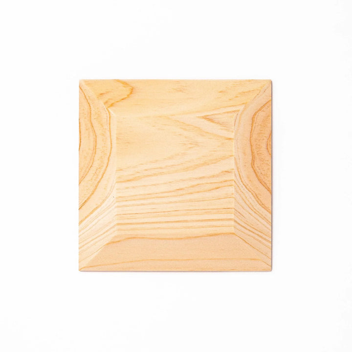 Square hinoki wood coaster with recessed circular center and beveled edge, featuring natural grain for elegant cup support.
