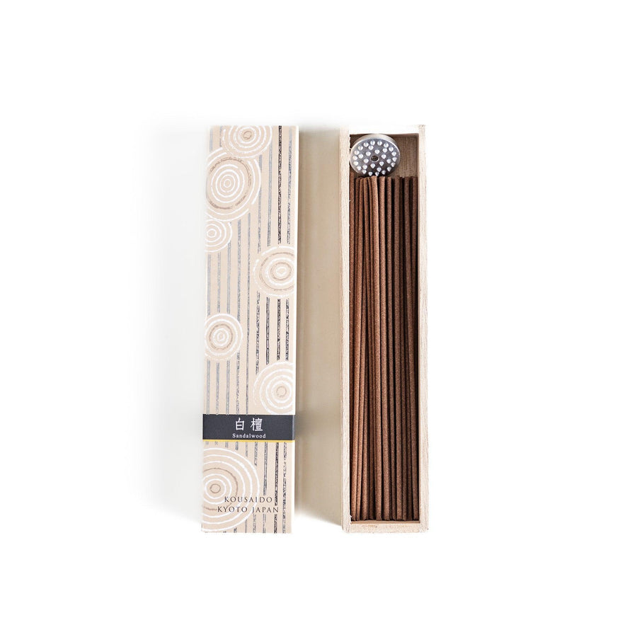 Japanese sandalwood incense sticks in a wooden box with an elegant beige patterned sleeve from Kyoto’s Kousaido