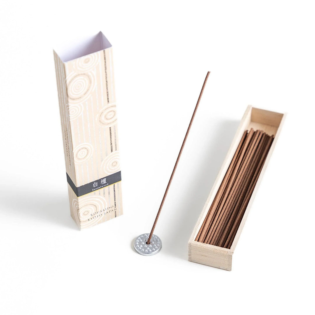 Japanese sandalwood incense sticks in a wooden box with an elegant beige patterned sleeve from Kyoto’s Kousaido