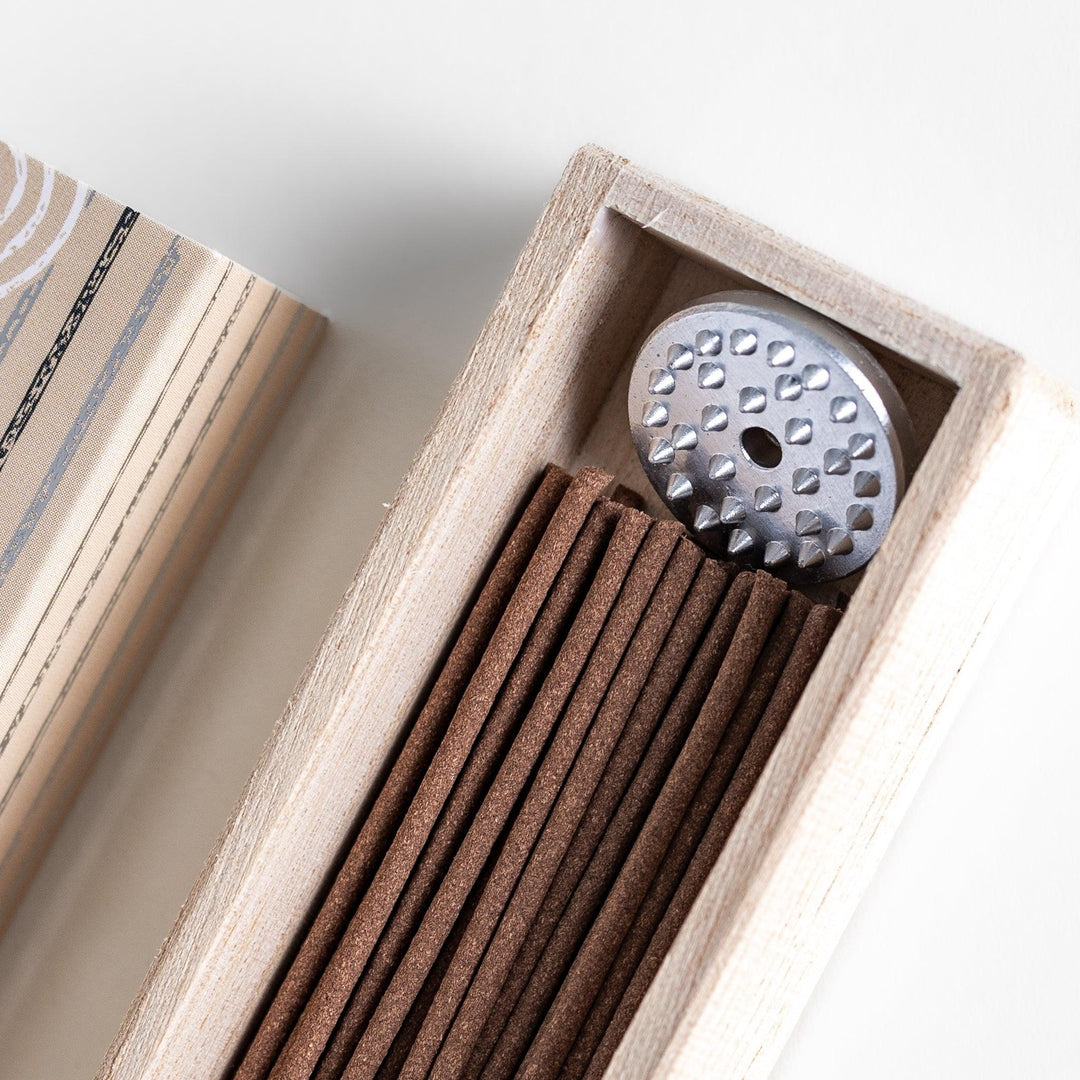 Japanese sandalwood incense sticks in a wooden box with an elegant beige patterned sleeve from Kyoto’s Kousaido