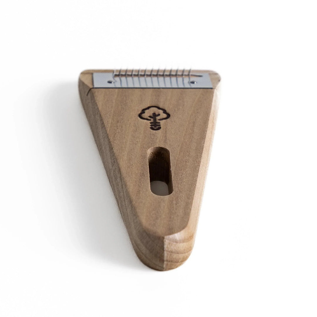 Nagomi Damascus utility knife with patterned blade and striped wooden handle offering precise everyday cutting.