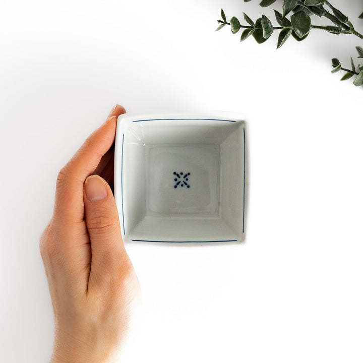 Traditional flower and bird design adorns this elegant condiment bowl, framed with intricate blue patterns.