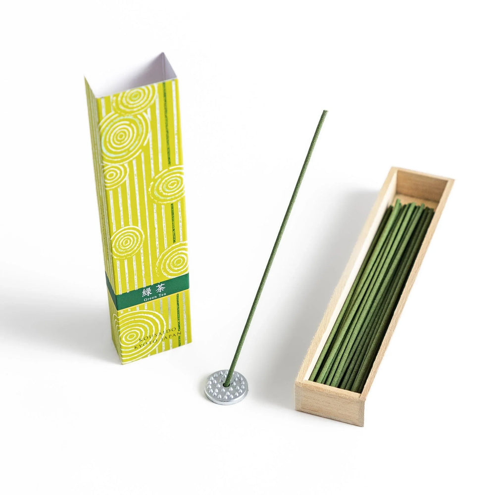 Japanese Green Tea incense sticks in a yellow patterned box with wooden holder, offering a fresh, soothing aroma from Kyoto