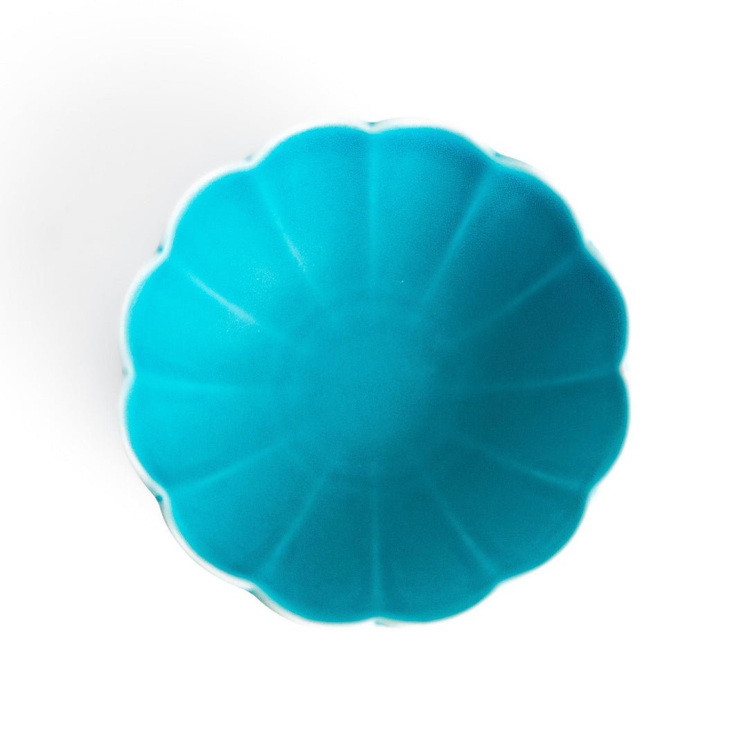 Turkish blue lotus-shaped dessert bowl with matte finish and white base, featuring delicate petal-like detailing.