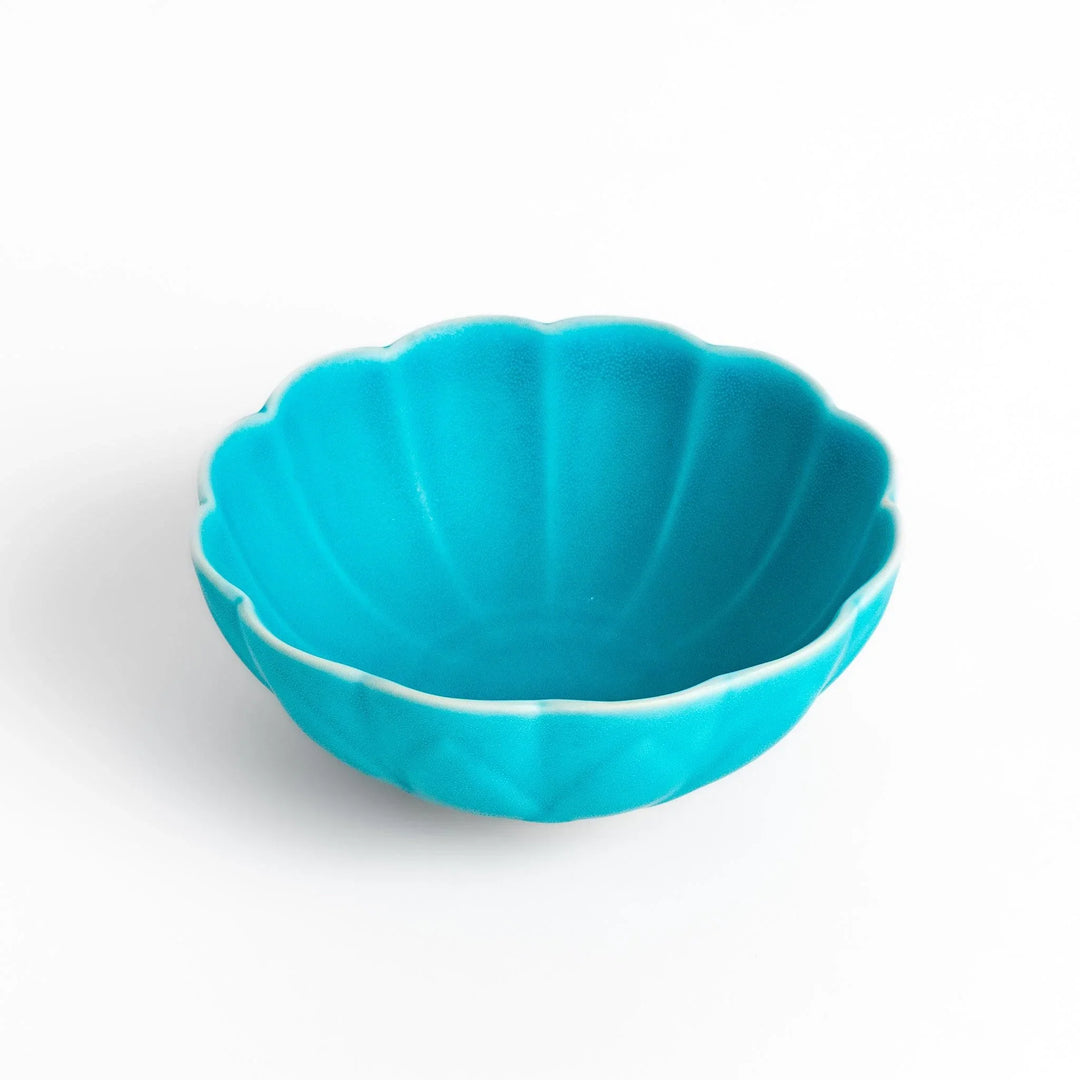 Turkish blue lotus-shaped dessert bowl with matte finish and white base, featuring delicate petal-like detailing.