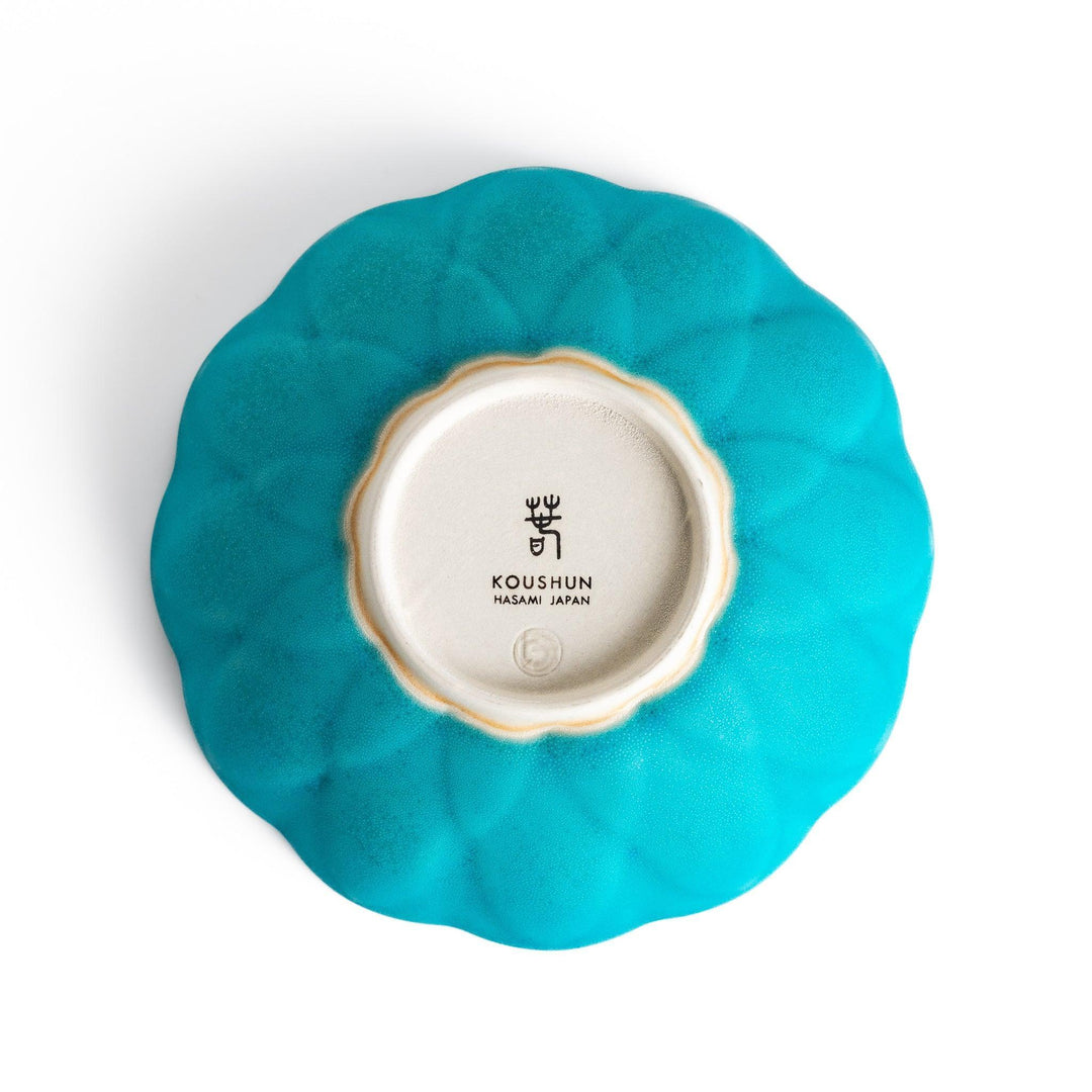 Turkish blue lotus-shaped dessert bowl with matte finish and white base, featuring delicate petal-like detailing.