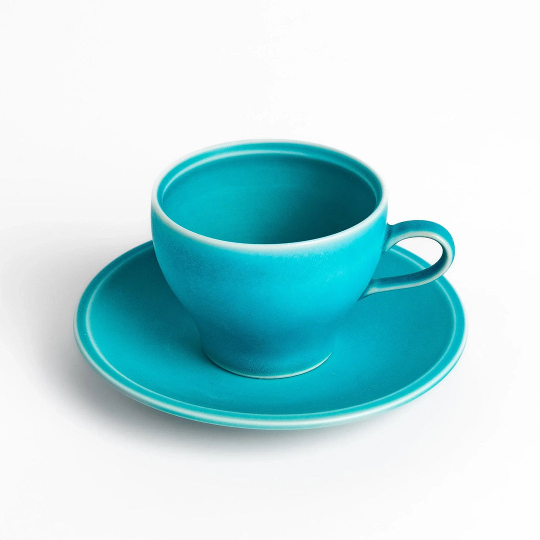 Turkish blue tea cup and saucer set with matte finish, offering a modern and elegant touch to tea rituals.