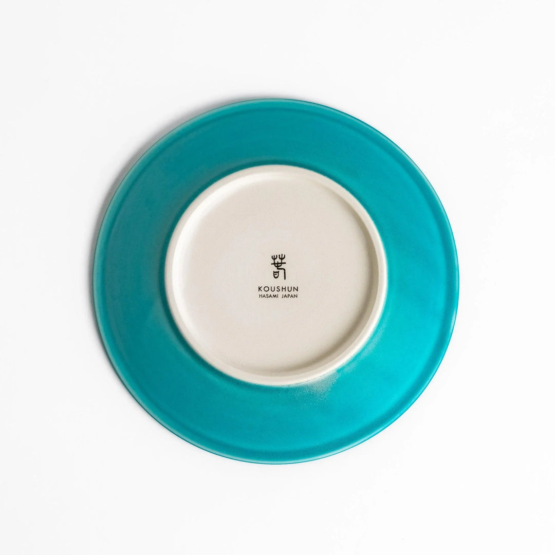 Turkish blue saucer with smooth matte finish and clean design, complementing a minimalist tea cup.