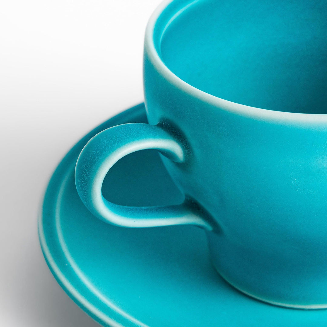 Turkish blue tea cup and saucer set with matte finish, offering a modern and elegant touch to tea rituals.