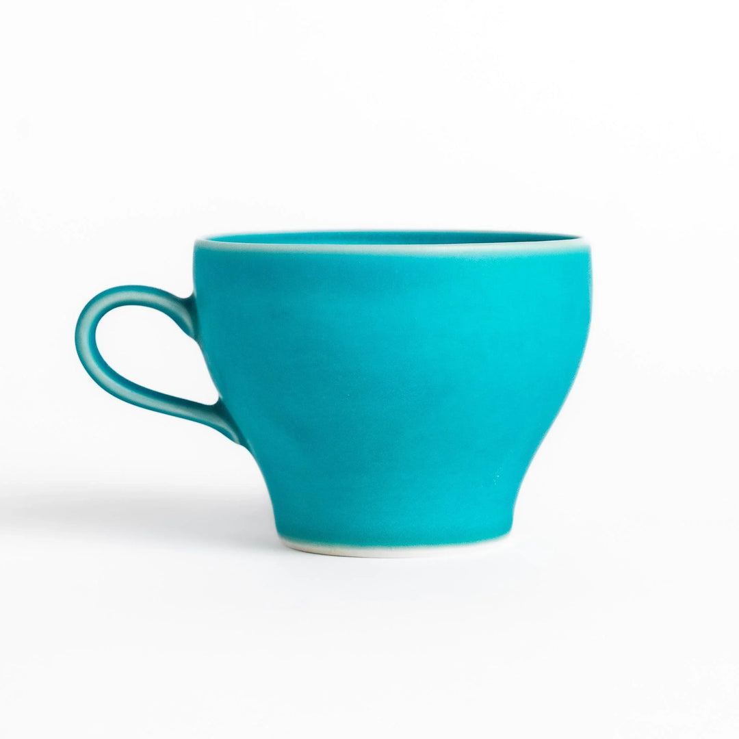 Turkish blue tea cup with matte finish and elegant curved shape, perfect for modern tea enjoyment.