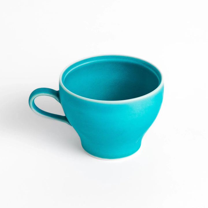 Turkish blue tea cup with matte finish and elegant curved shape, perfect for modern tea enjoyment.