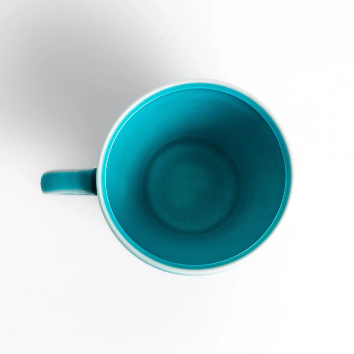 Turkish blue tea cup with matte finish and elegant curved shape, perfect for modern tea enjoyment.