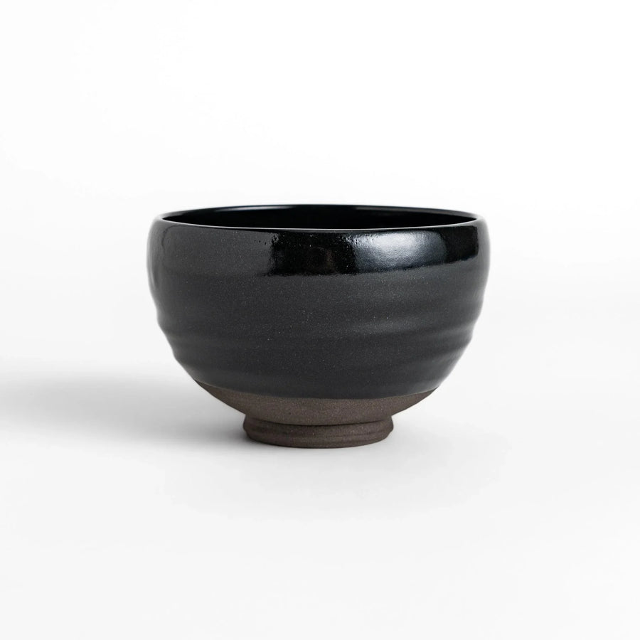 Elegant black ceramic Matcha bowl with a minimalist design, ideal for preparing and serving Matcha.
