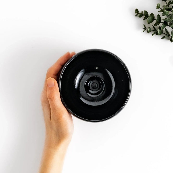 Elegant black ceramic Matcha bowl with a minimalist design, ideal for preparing and serving Matcha.