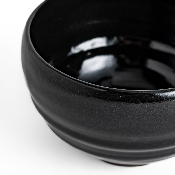 Elegant black ceramic Matcha bowl with a minimalist design, ideal for preparing and serving Matcha.