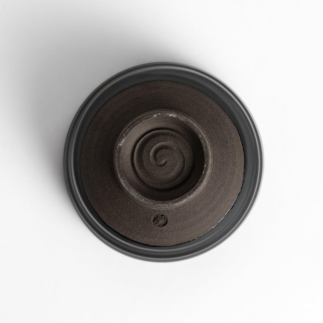 Elegant black ceramic Matcha bowl with a minimalist design, ideal for preparing and serving Matcha.
