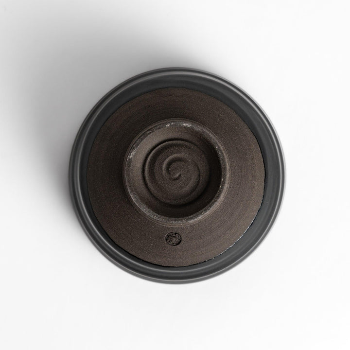 Elegant black ceramic Matcha bowl with a minimalist design, ideal for preparing and serving Matcha.