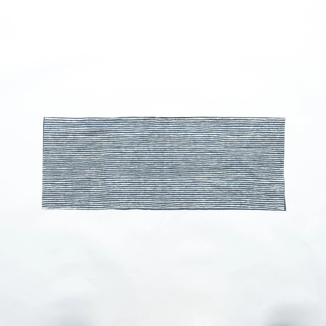 Gray hand towel with vertical white stripes, laid flat for full view.
