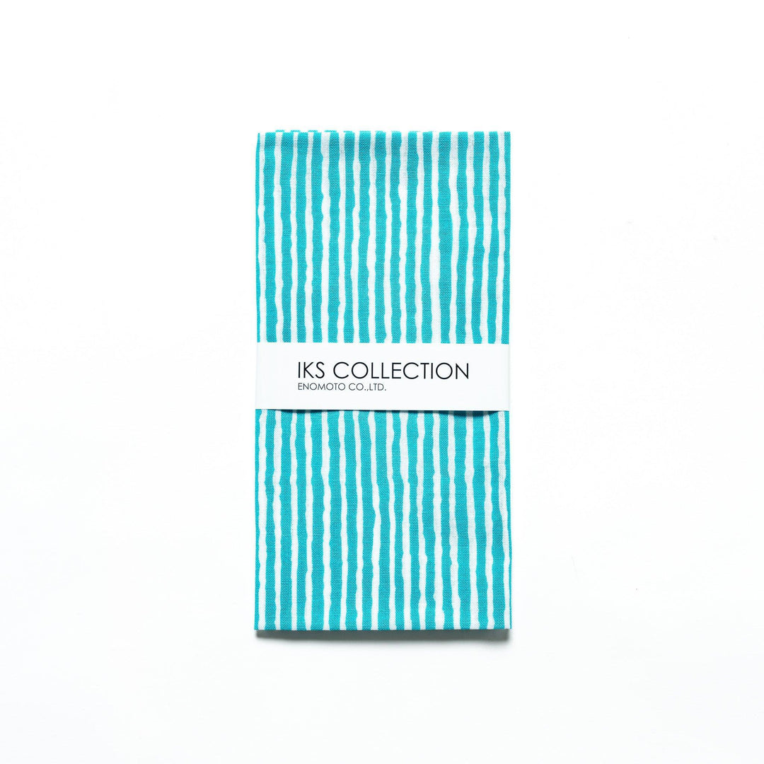 Bright blue hand towel with vertical white stripes, folded with a product sleeve.