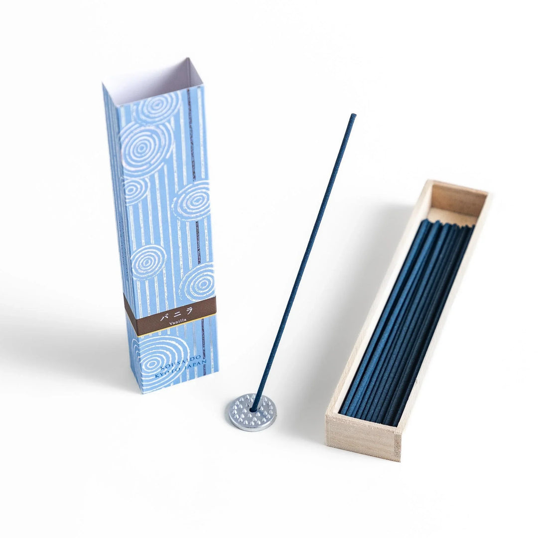 Japanese Vanilla incense sticks in a light blue patterned box with wooden holder, offering a warm and comforting fragrance