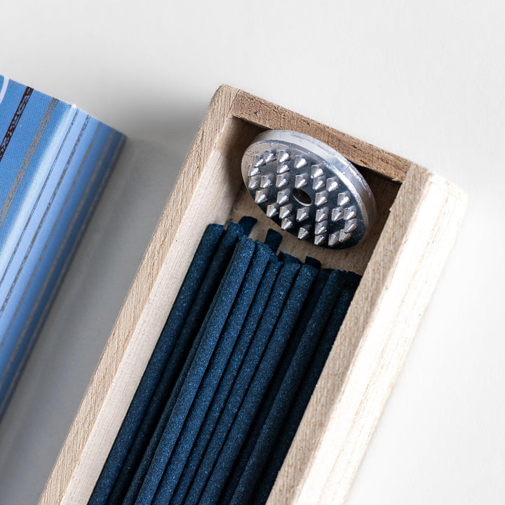 Japanese Vanilla incense sticks in a light blue patterned box with wooden holder, offering a warm and comforting fragrance