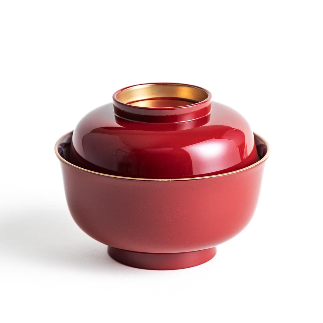 Glossy lacquer soup bowl with matching lid and gold rim available in black or red for elegant serving.