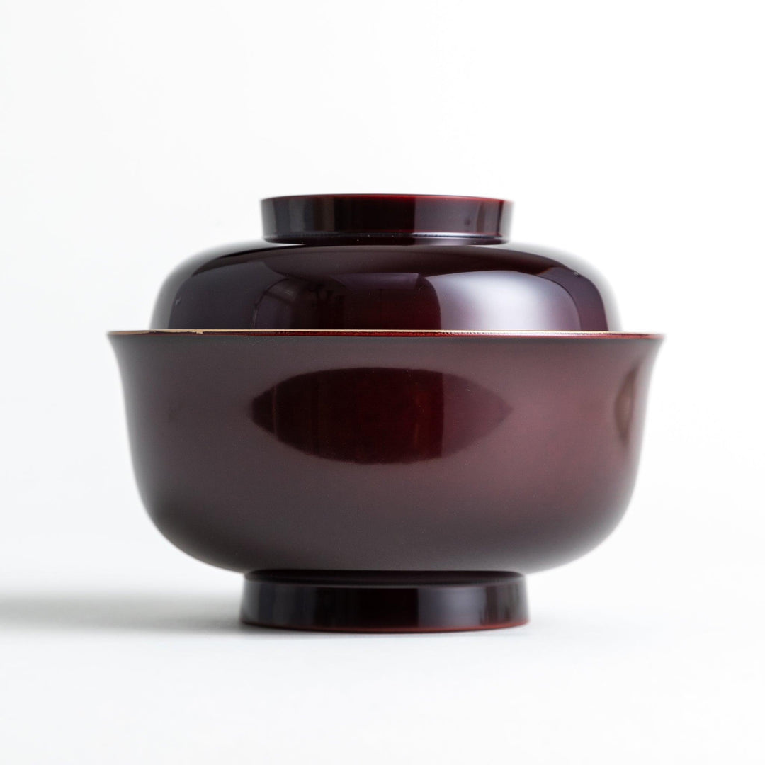 Glossy lacquer soup bowl with matching lid and gold rim available in black or red for elegant serving.