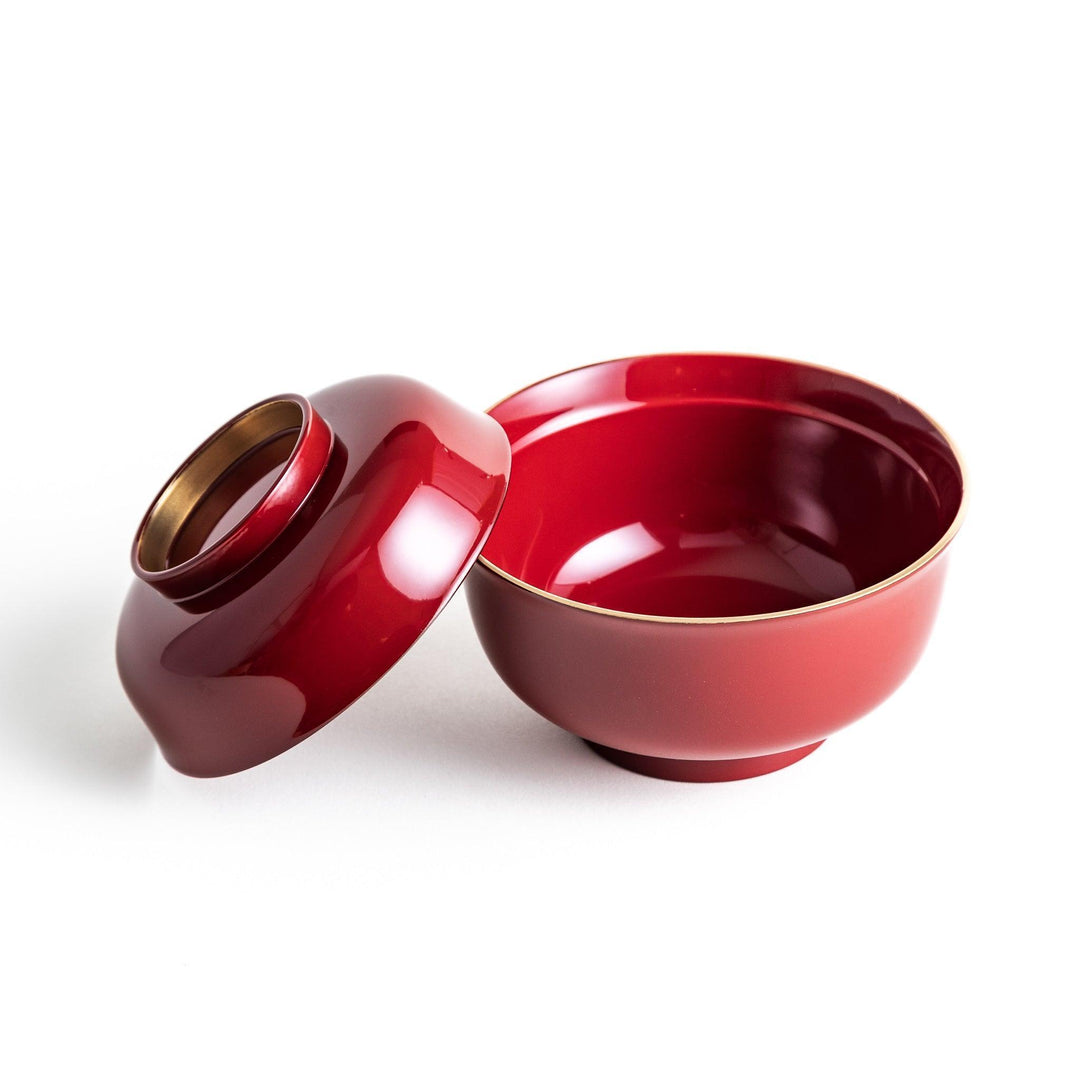 Glossy lacquer soup bowl with matching lid and gold rim available in black or red for elegant serving.
