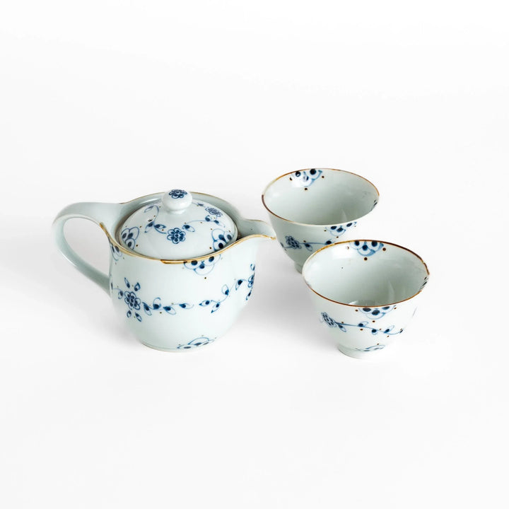 Vintage vine flower tea set with a beautifully detailed teapot and matching teacups, perfect for a charming tea experience.