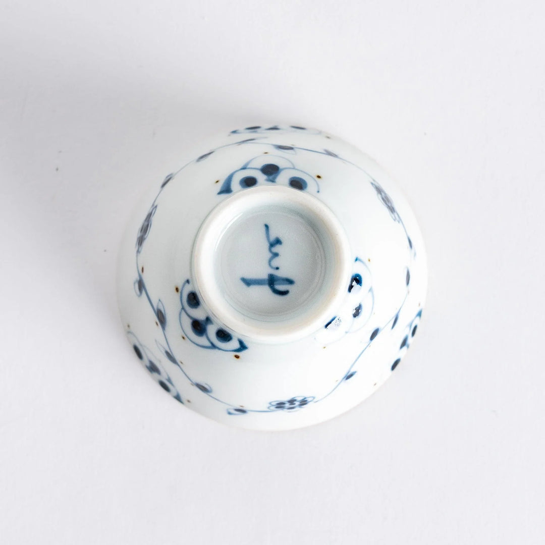 Underside of the vintage vine flower teacup, revealing the intricate floral details and authentic craftsmanship.