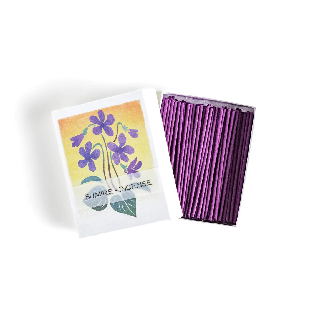 Incense with violet sticks in a box with violet flower design offering a floral soothing fragrance for relaxation.