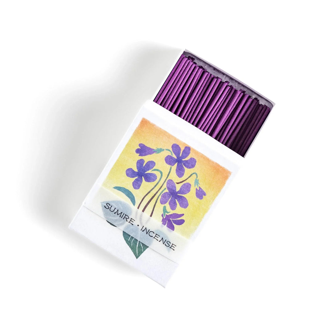 Incense with violet sticks in a box with violet flower design offering a floral soothing fragrance for relaxation.