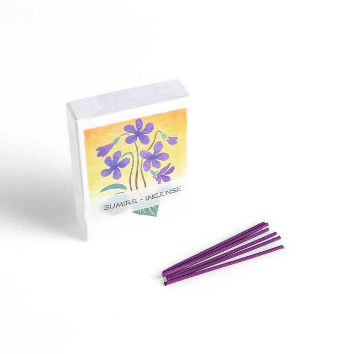 Incense with violet sticks in a box with violet flower design offering a floral soothing fragrance for relaxation.