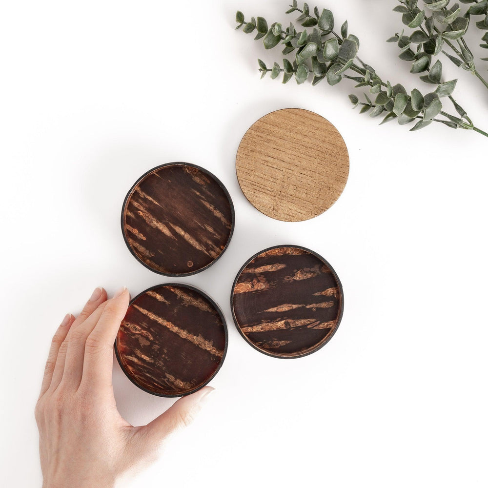 Walnut and cherry bark jewelry case with wavy design perfect for storing small accessories elegantly.