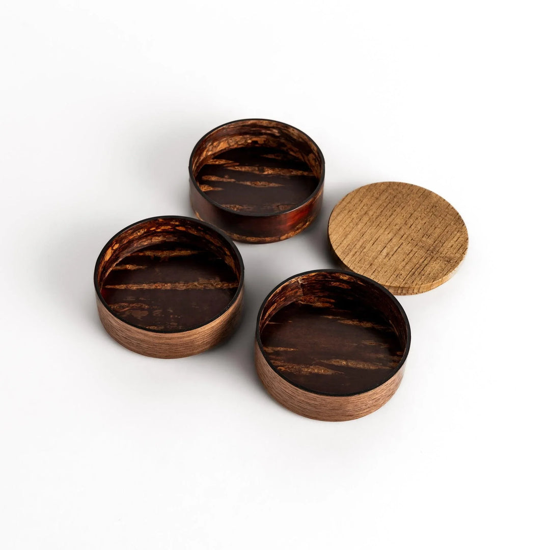 Walnut and cherry bark jewelry case with wavy design perfect for storing small accessories elegantly.