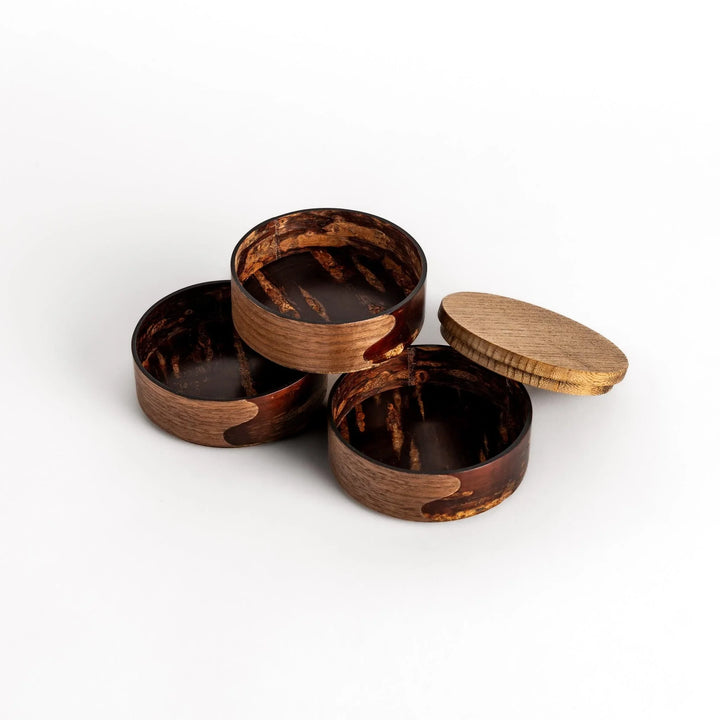 Walnut and cherry bark jewelry case with wavy design perfect for storing small accessories elegantly.