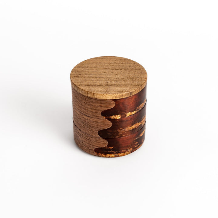 Walnut and cherry bark jewelry case with wavy design perfect for storing small accessories elegantly.