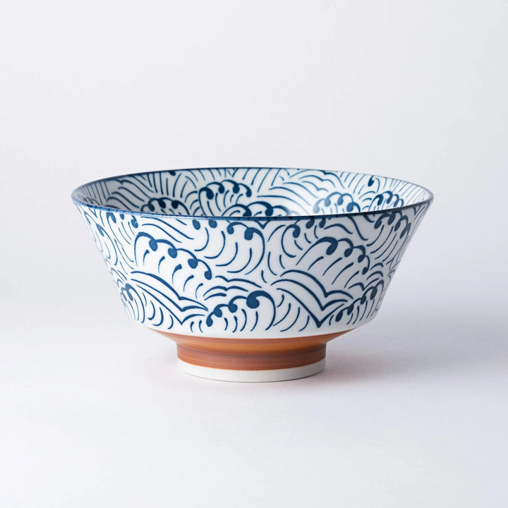 Blue and white ramen bowl with wave pattern.