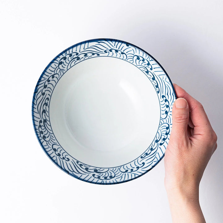 Blue and white ramen bowl with wave pattern.