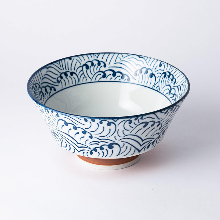 Blue and white ramen bowl with wave pattern.