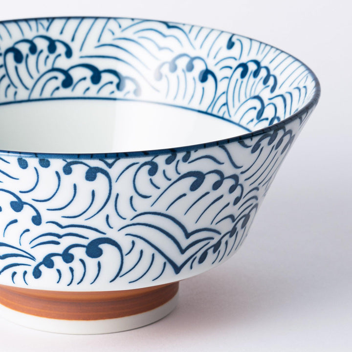 Blue and white ramen bowl with wave pattern.