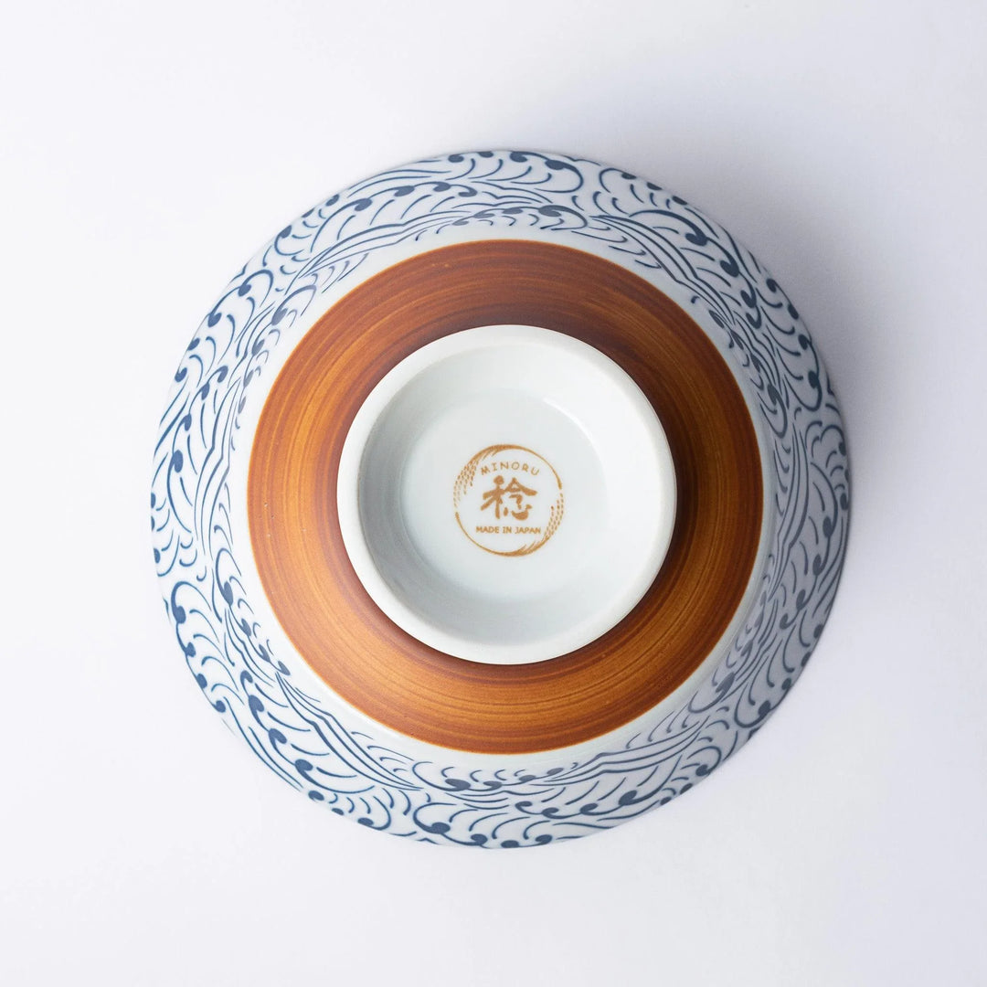 Blue and white ramen bowl with wave pattern.