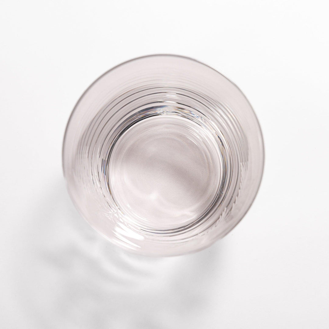 Rocks glass with delicate fern engravings, ideal for serving whiskey or fine drinks in refined style.