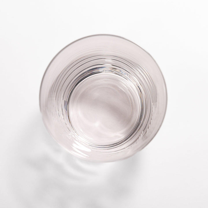 Rocks glass with delicate fern engravings, ideal for serving whiskey or fine drinks in refined style.