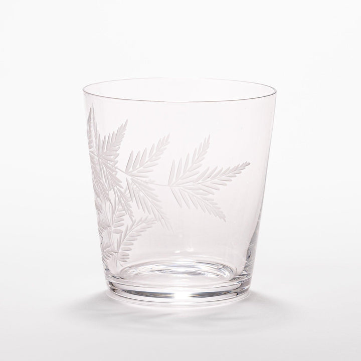 Rocks glass with delicate fern engravings, ideal for serving whiskey or fine drinks in refined style.
