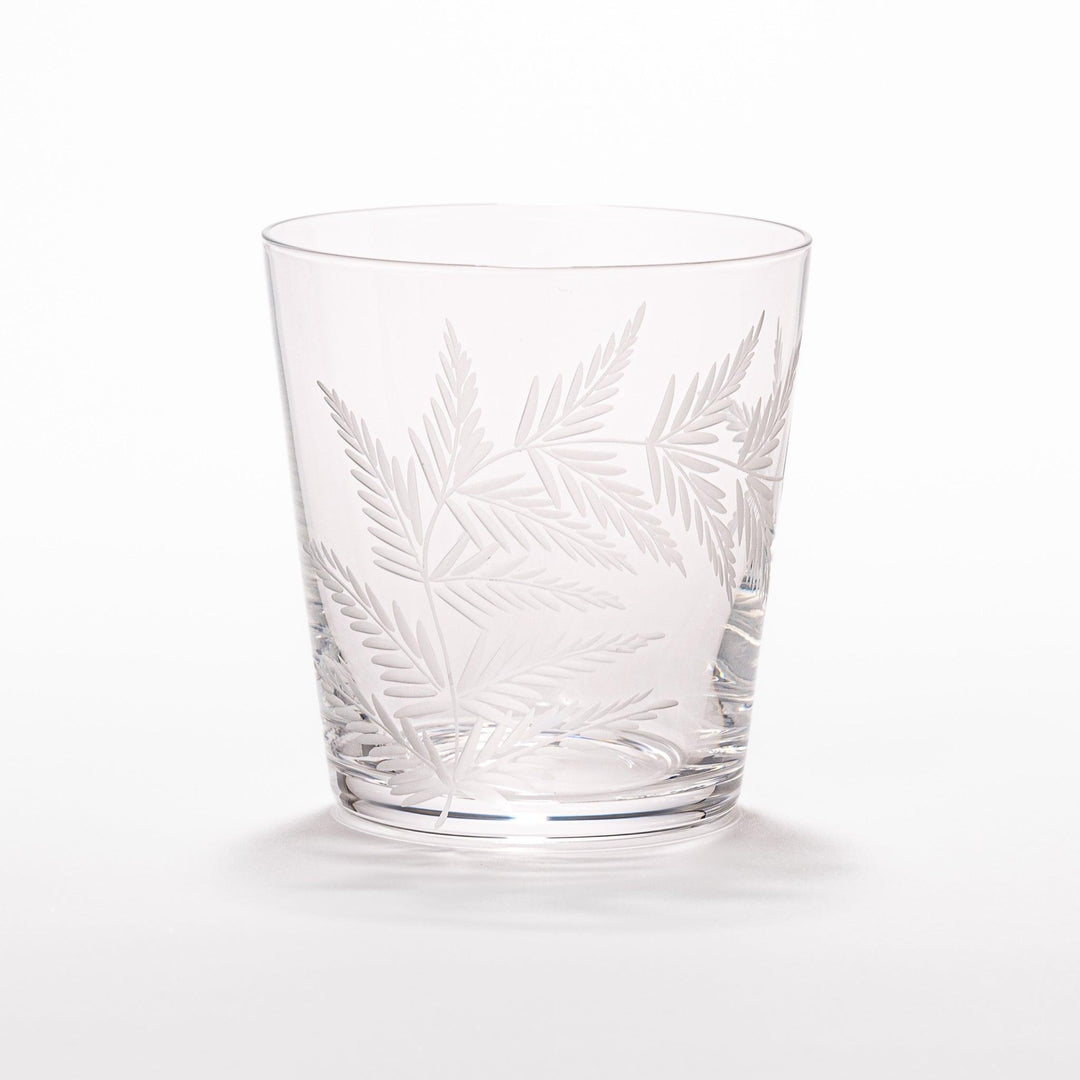Rocks glass with delicate fern engravings, ideal for serving whiskey or fine drinks in refined style.
