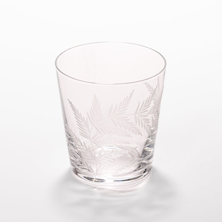 Rocks glass with delicate fern engravings, ideal for serving whiskey or fine drinks in refined style.