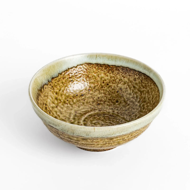 Ramen bowl featuring a beautiful white drip glaze over an earthy, textured base, combining natural tones of brown and green.
