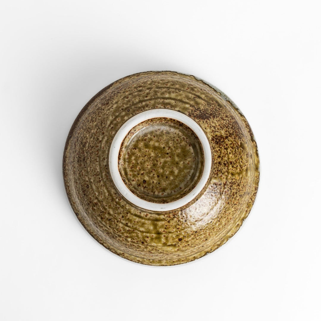 Ramen bowl featuring a beautiful white drip glaze over an earthy, textured base, combining natural tones of brown and green.